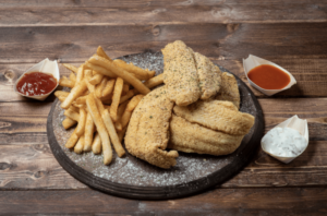 fried catfish with french fries and sauces