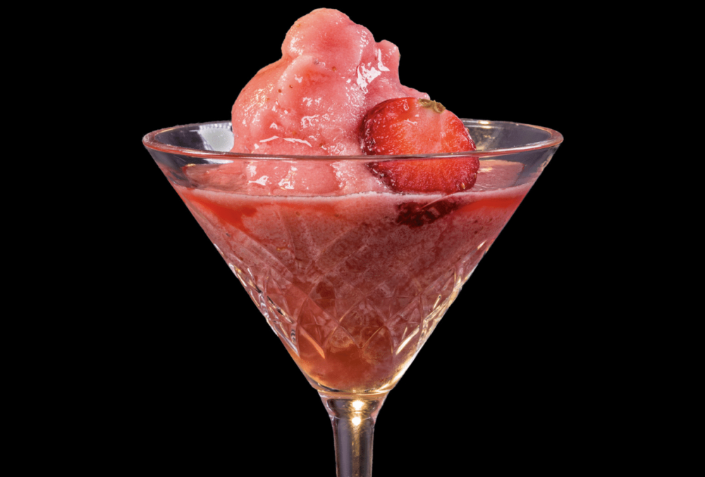 frozen strawberry daiquiri in martini glass